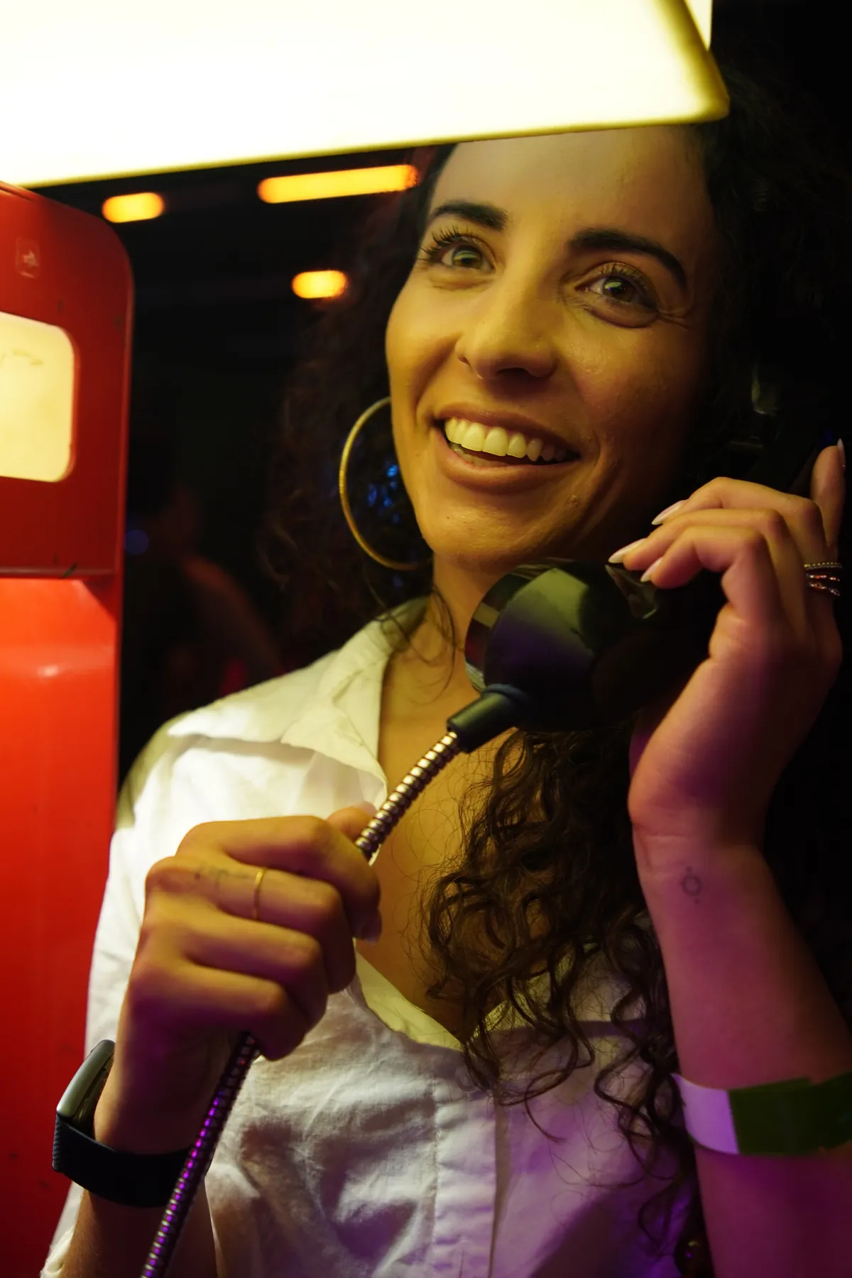 Smiling portrait holding a karaoke microphone