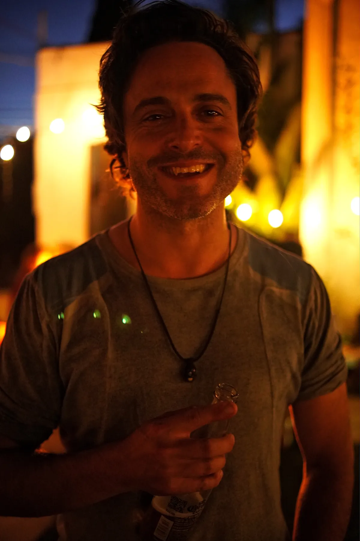 Warm-lit portrait at a bar