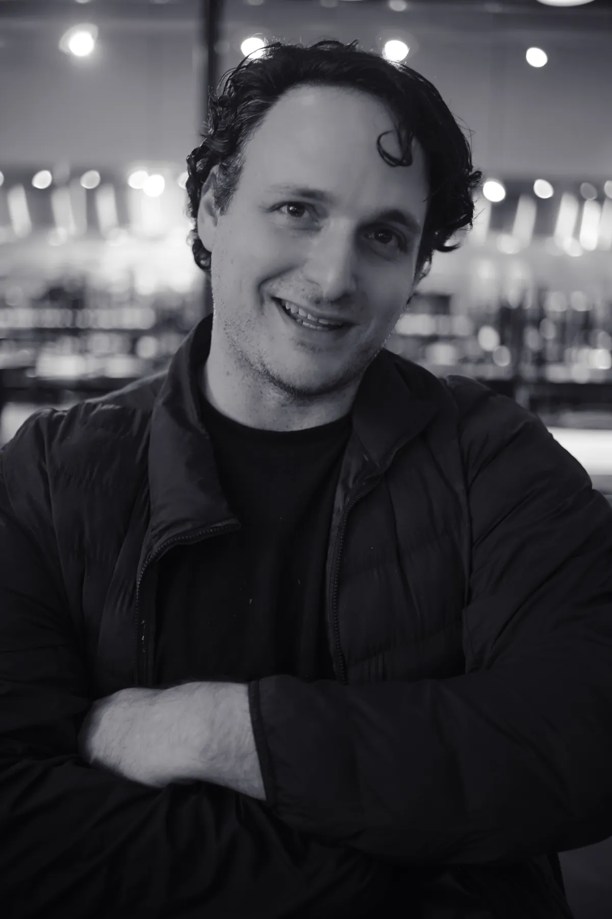 Black-and-white portrait with string lights