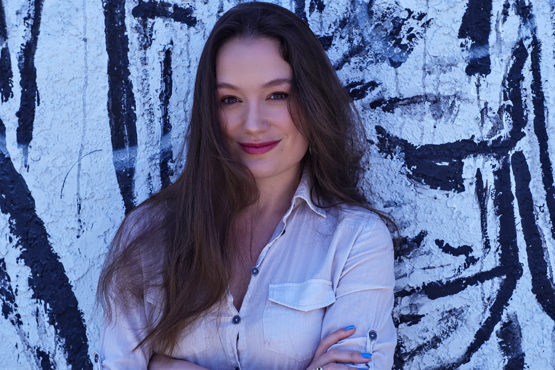 Portrait against a black-and-white painted wall